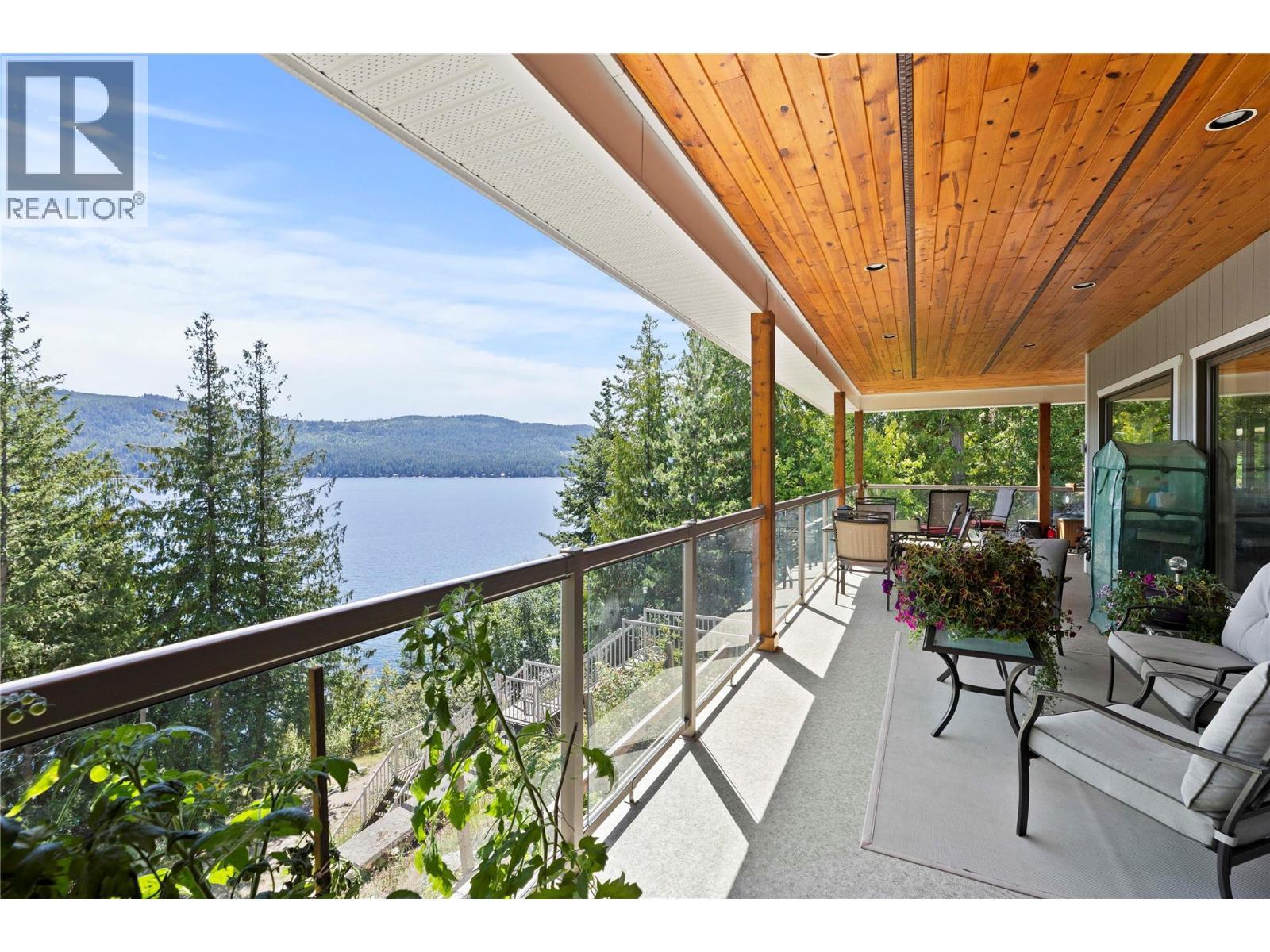 Main floor covered deck - 8738 Squilax Anglemont Road, St. Ives, BC - Outdoor With Body Of Water With View With Exterior