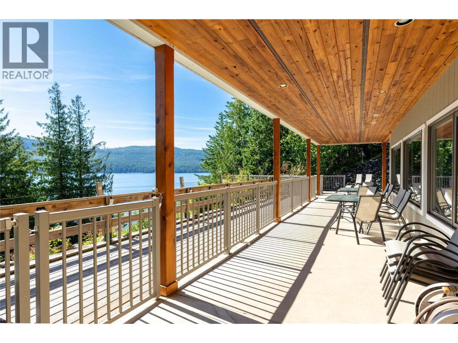 Suite level, covered deck - 8738 Squilax Anglemont Road, St. Ives, BC - Outdoor With Body Of Water With Deck Patio Veranda With Exterior