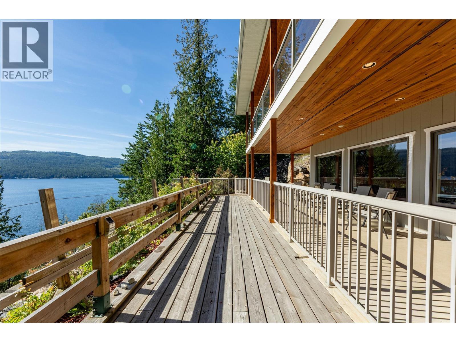 8738 Squilax Anglemont Road, St. Ives, BC - Outdoor With Body Of Water With Deck Patio Veranda With Exterior