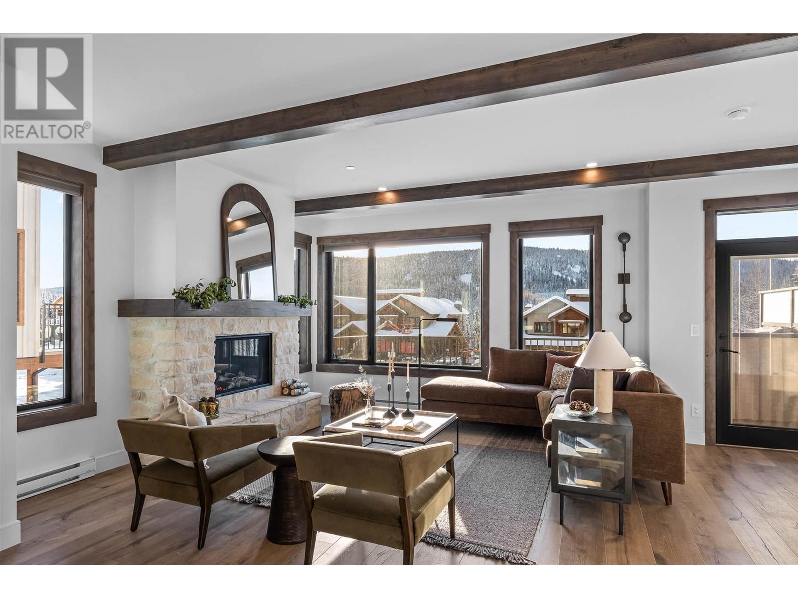 7000 Mcgillivray Lake Drive Unit# 12, Sun Peaks, BC - Indoor Photo Showing Living Room With Fireplace