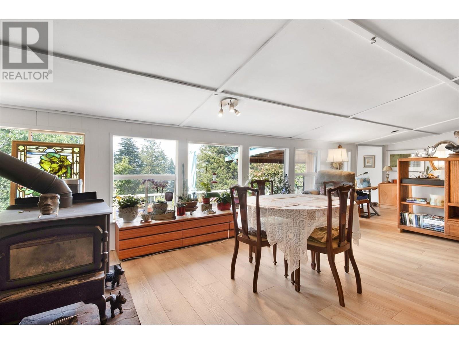 3096 Lindberg Road, Sorrento, BC - Indoor Photo Showing Dining Room With Fireplace