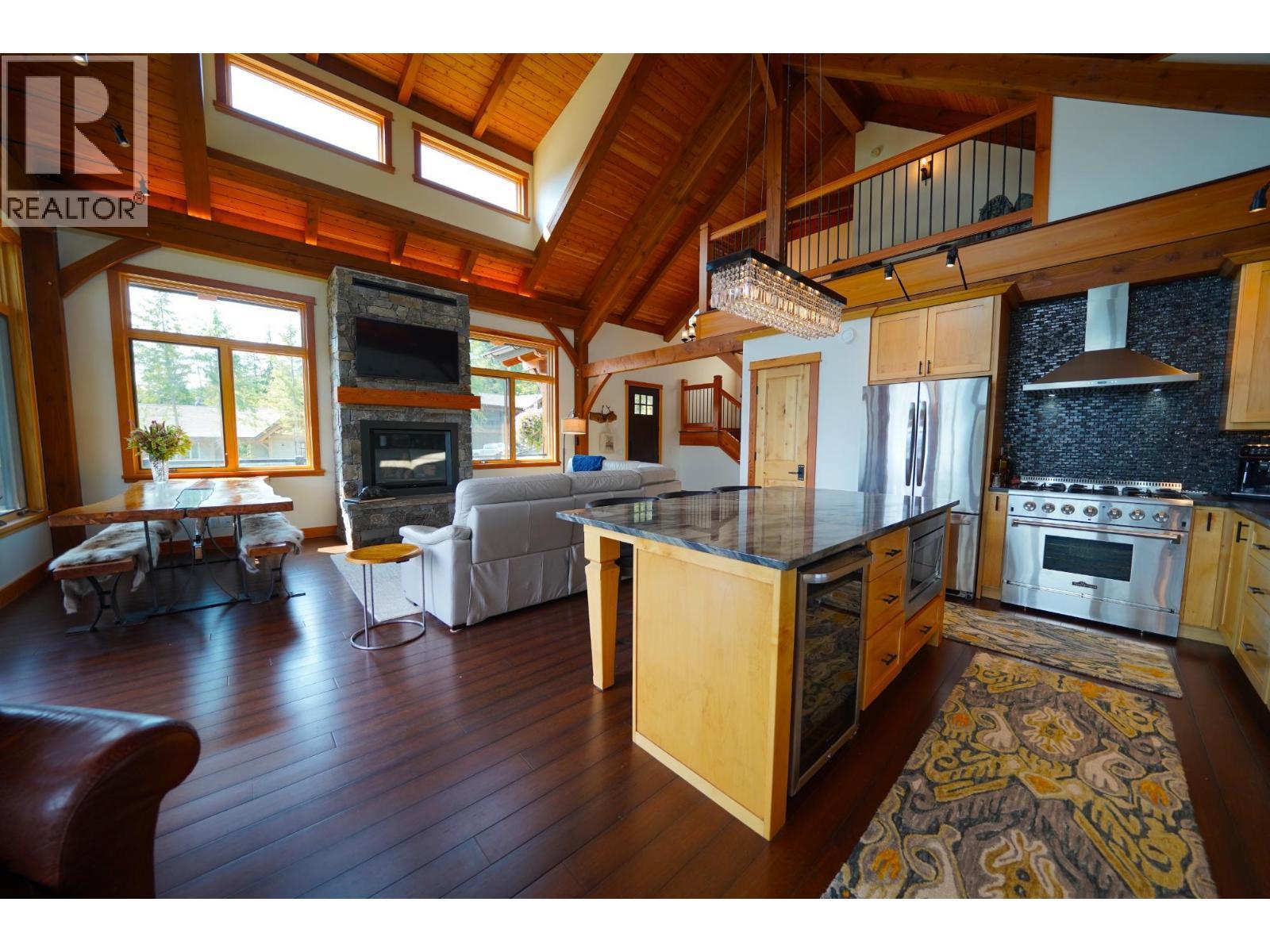 26 Birchgrove Bend, Kaslo, BC - Indoor Photo Showing Kitchen With Fireplace With Upgraded Kitchen