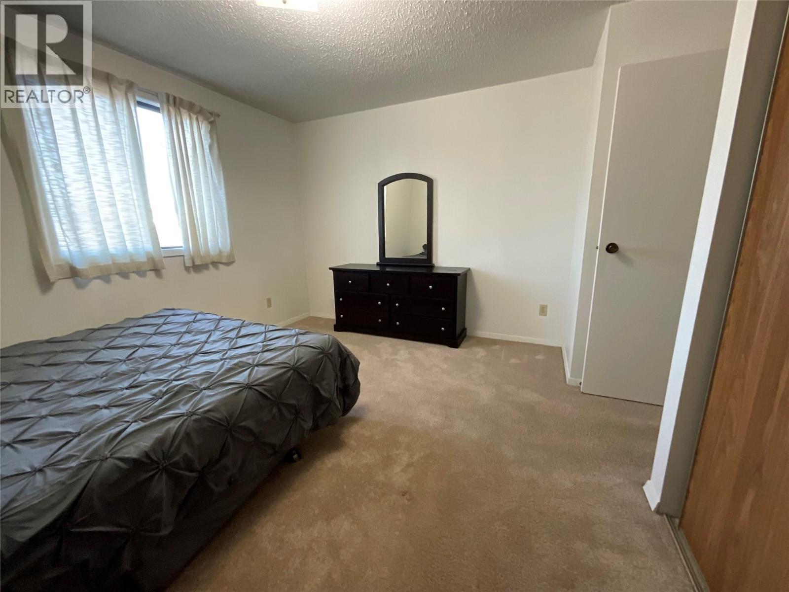 212 Spieker Avenue Unit# 202, Tumbler Ridge, BC - Indoor Photo Showing Bedroom