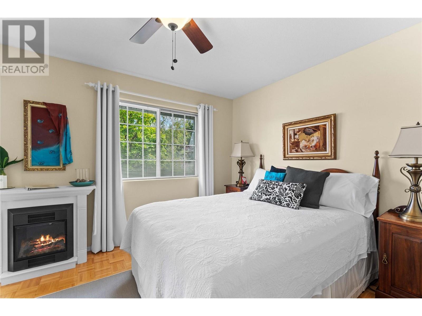 2847 Walsh Road, Sorrento, BC - Indoor Photo Showing Bedroom With Fireplace