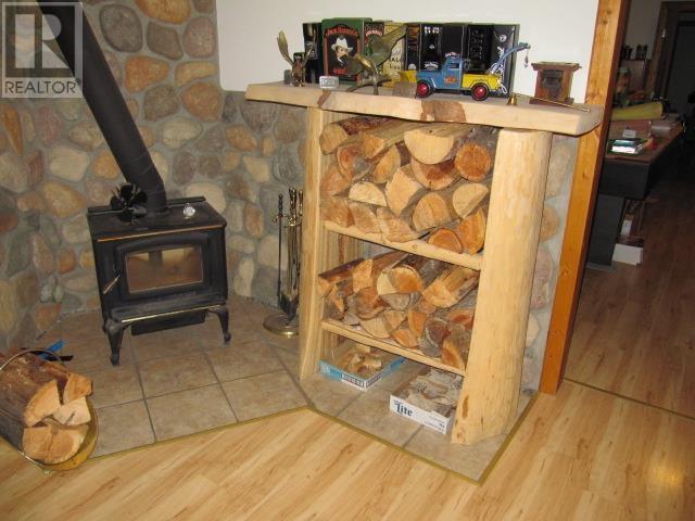 3561 Canim-Hendrix Lake Road, 100 Mile House, BC - Indoor Photo Showing Other Room With Fireplace