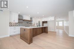 Kitchen & view of Family room -