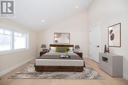 Digitally staged. Bedroom 2 with 3-piece Ensuite -