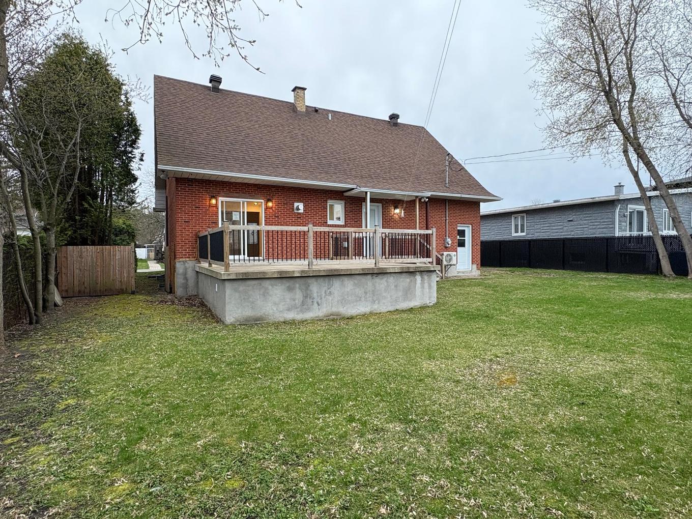 Face arrière - 18 Rue Marie-Antoinette, Blainville, QC - Outdoor With Above Ground Pool With Deck Patio Veranda