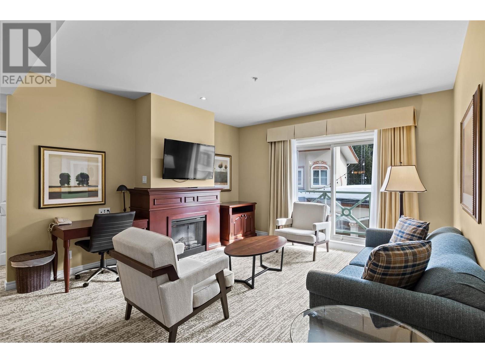 3250 Village Way Unit# 1201Abcd, Sun Peaks, BC - Indoor Photo Showing Living Room With Fireplace