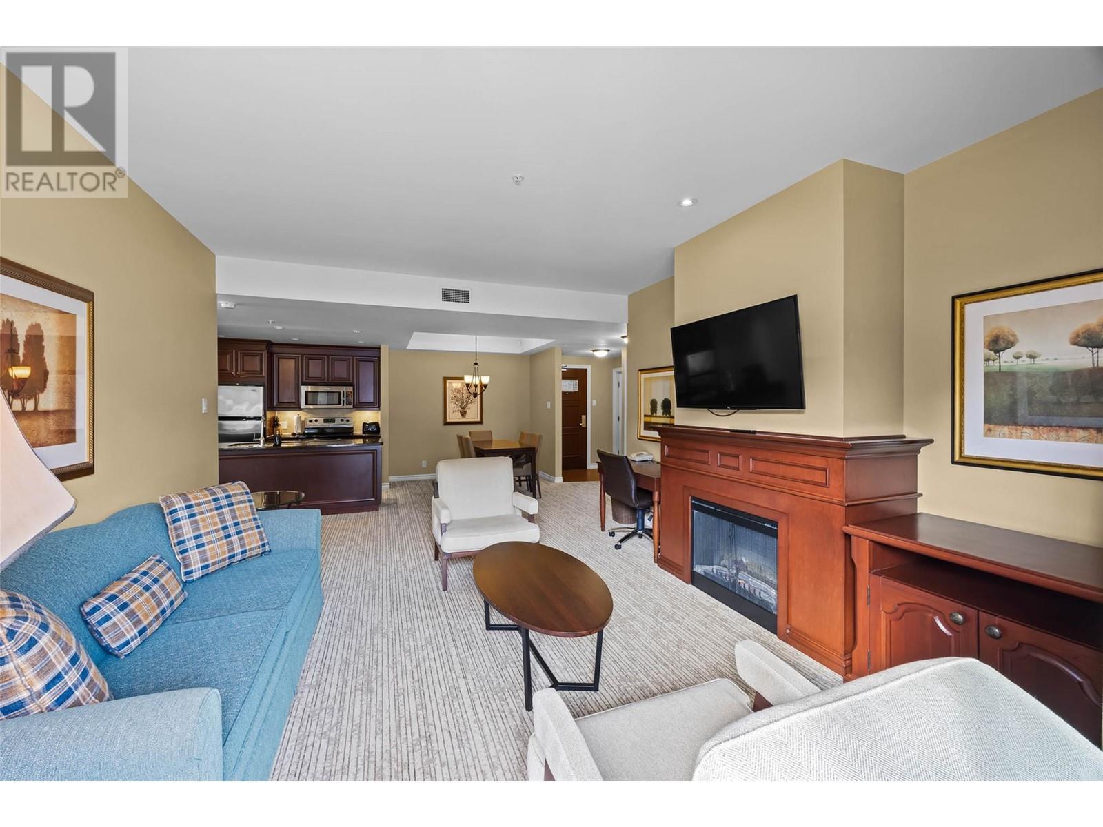 3250 Village Way Unit# 1201Abcd, Sun Peaks, BC - Indoor Photo Showing Living Room With Fireplace