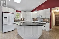 Large island with granite counter tops -