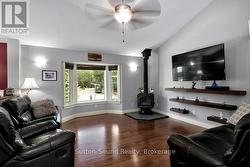 Vaulted ceilings, Wood fireplace, large window -