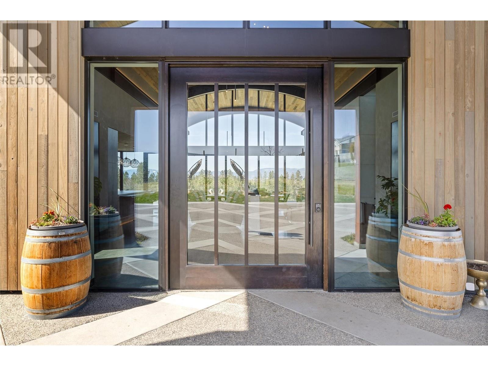 Stunning Hemlock archway carried through the home - 4275 Todd Road, Kelowna, BC - Outdoor With Exterior