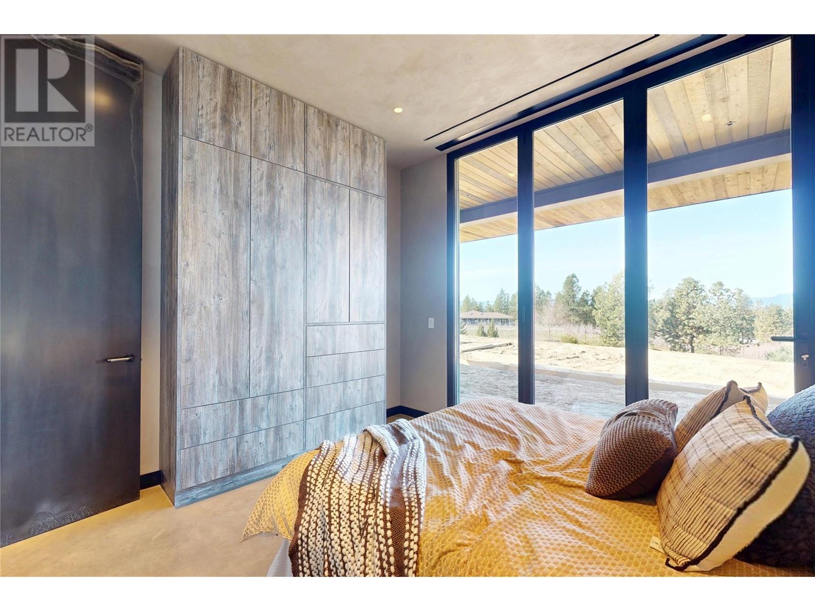 Third Bedroom also with outdoor access - 4275 Todd Road, Kelowna, BC - Indoor Photo Showing Bedroom