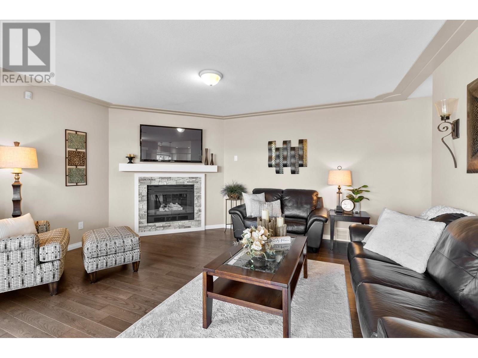 7115 Tronson Road, Vernon, BC - Indoor Photo Showing Living Room With Fireplace