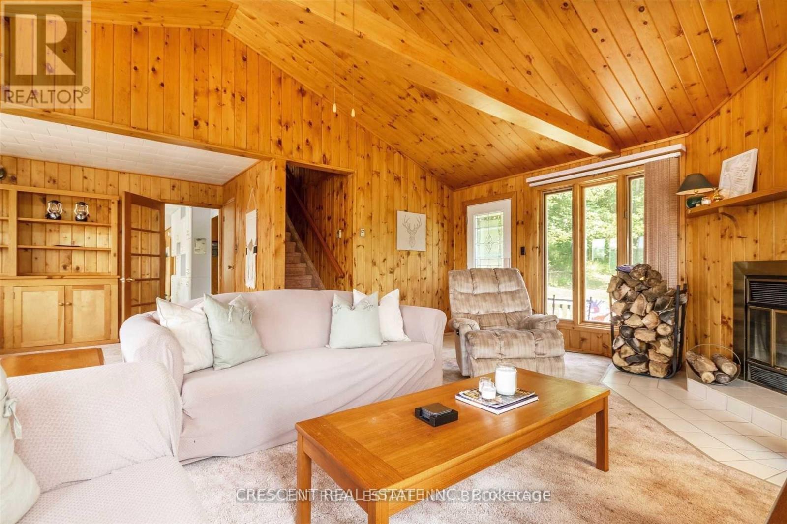 91 Jack'S Lake Road, Parry Sound Remote Area, ON - Indoor Photo Showing Living Room With Fireplace