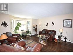Spacious living room with a large bay window -