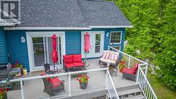Seating area on deck outside screened porch -