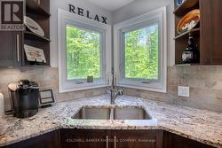 Sink in kitchen with view of outside -