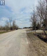 showing two driveways entering property -