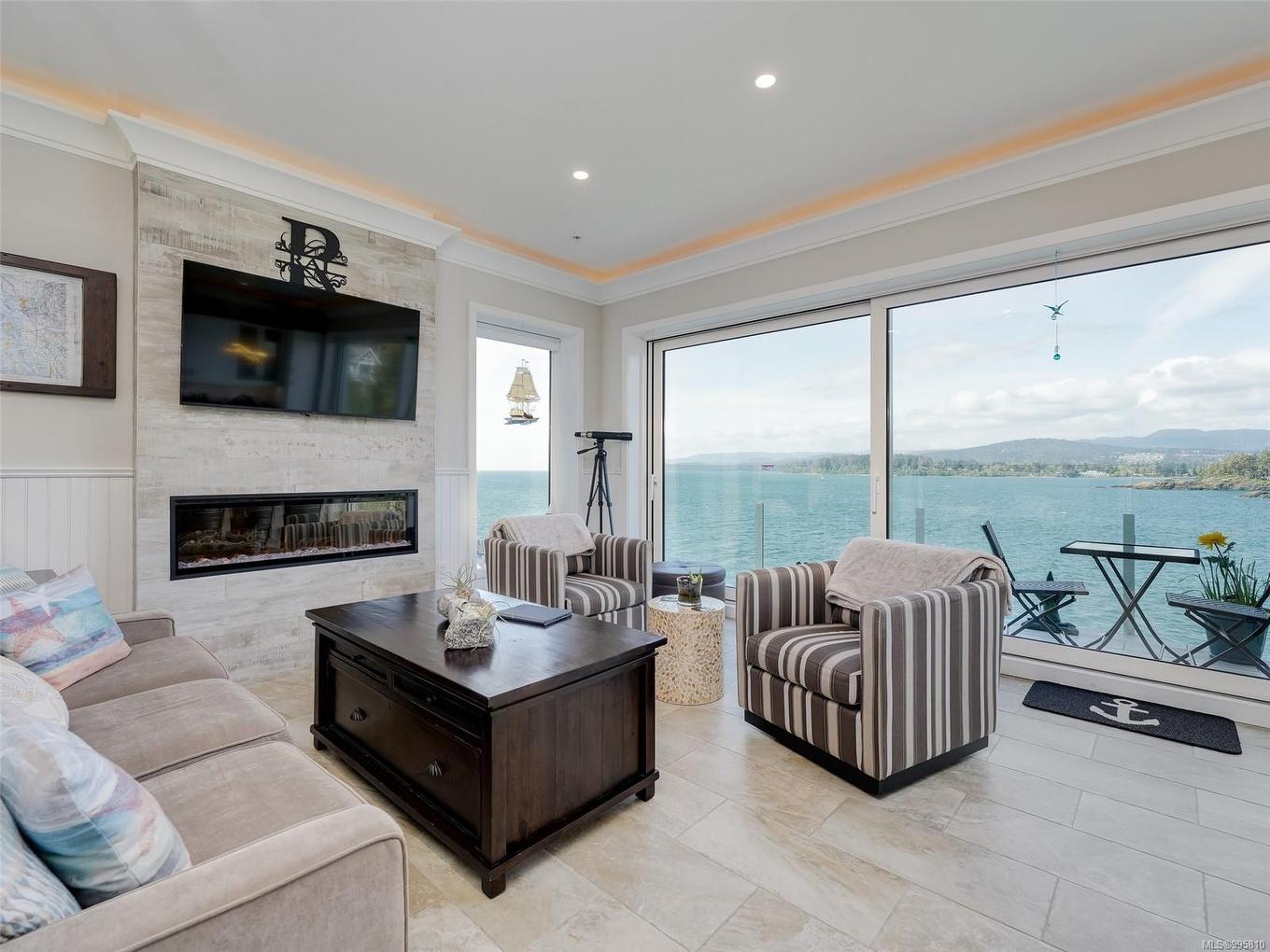 8B-1000 Sookepoint Pl, Sooke, BC - Indoor Photo Showing Living Room With Fireplace