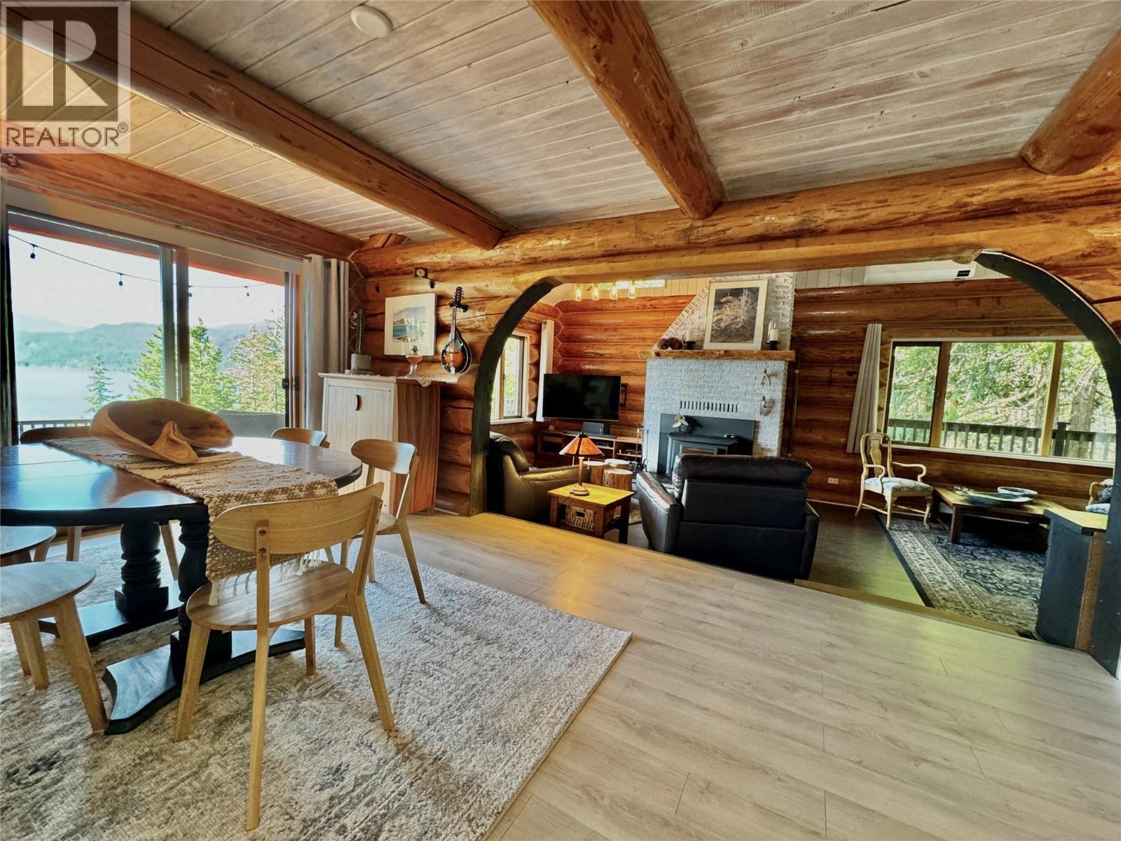 4258 31 Highway, Ainsworth, BC - Indoor Photo Showing Dining Room With Fireplace