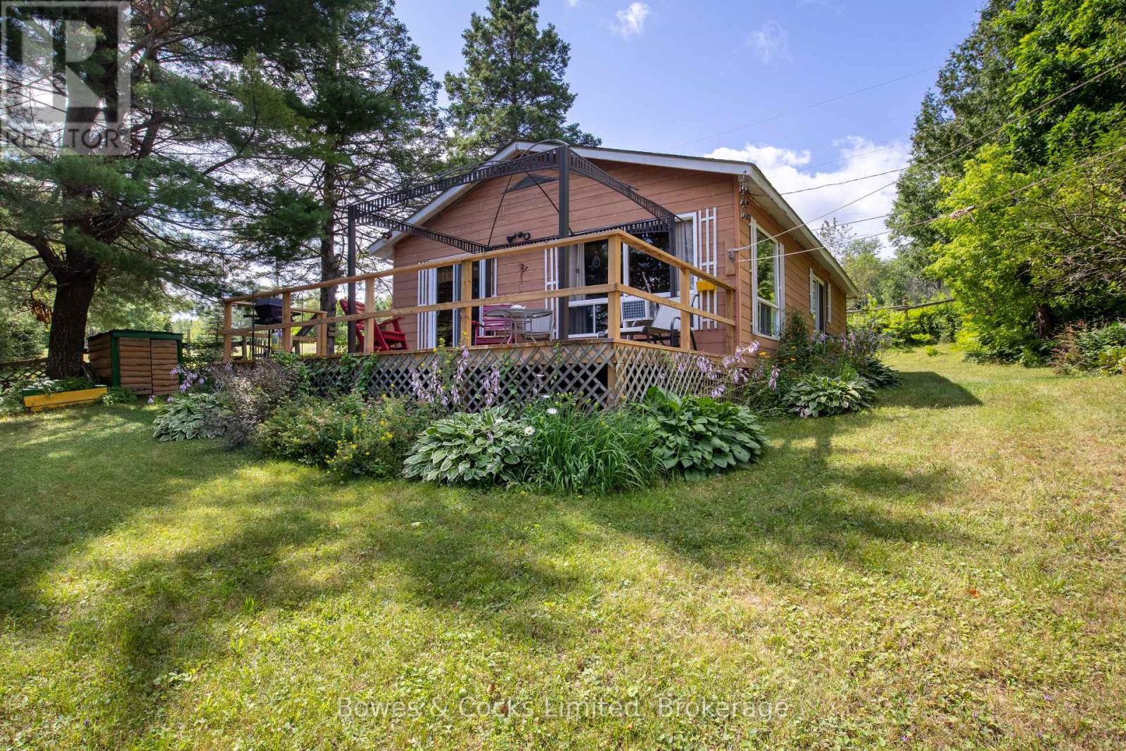 mature gardens - 197 King Road W, Wollaston, ON - Outdoor With Deck Patio Veranda