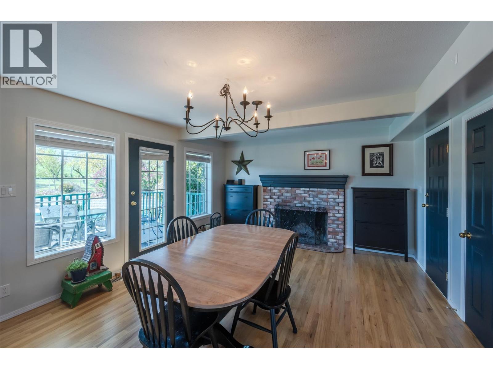 445 5 Road, Oliver, BC - Indoor Photo Showing Dining Room With Fireplace