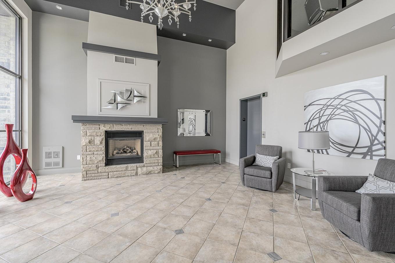 Hall - 410-2085 Place Du Club-Memphré, Magog, QC - Indoor Photo Showing Living Room With Fireplace