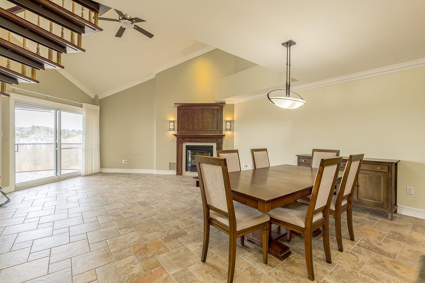 Dining room - 410-2085 Place Du Club-Memphré, Magog, QC - Indoor Photo Showing Dining Room With Fireplace
