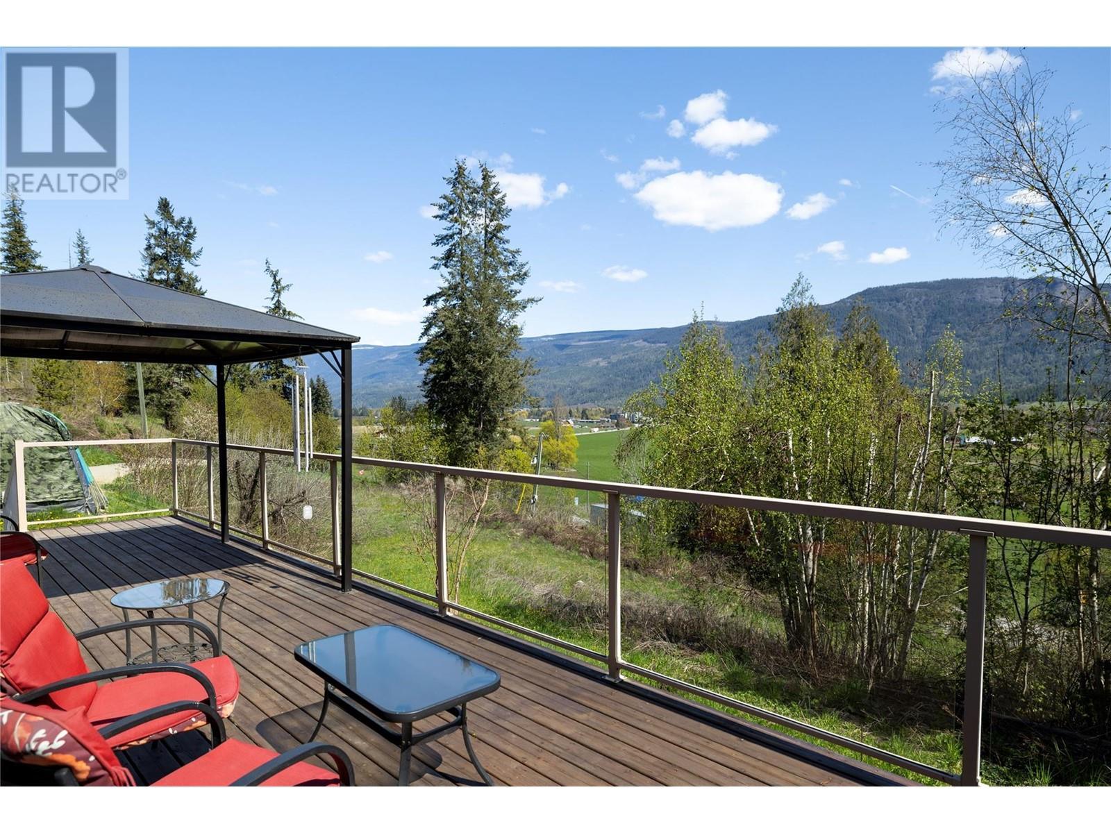 6740 Highway 97A Highway, Grindrod, BC - Outdoor With Deck Patio Veranda With View