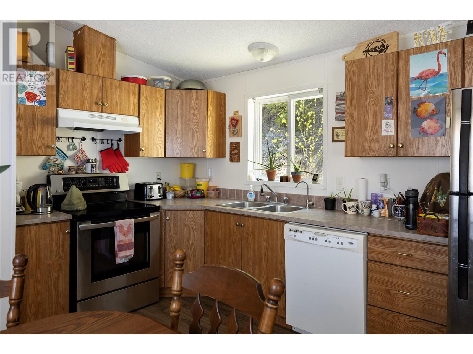 6740 Highway 97A Highway, Grindrod, BC - Indoor Photo Showing Kitchen With Double Sink
