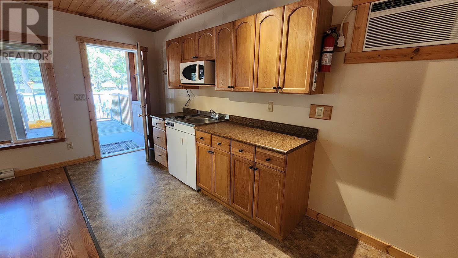 Cabin 1 interior - 16424 Wadds Road, Crawford Bay, BC - Indoor Photo Showing Kitchen With Double Sink