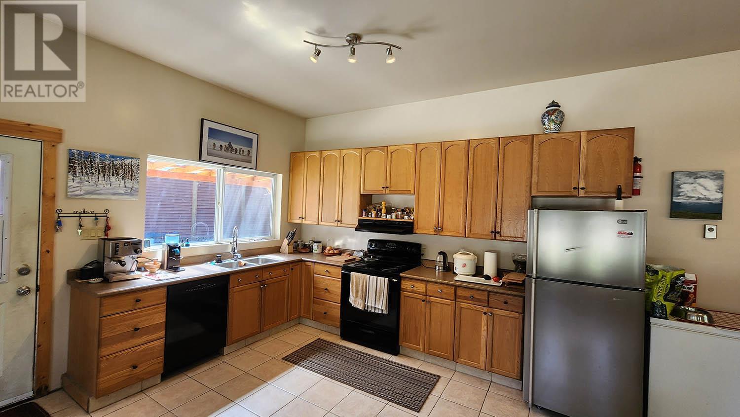 Main home, kitchen - 16424 Wadds Road, Crawford Bay, BC - Indoor Photo Showing Kitchen With Double Sink