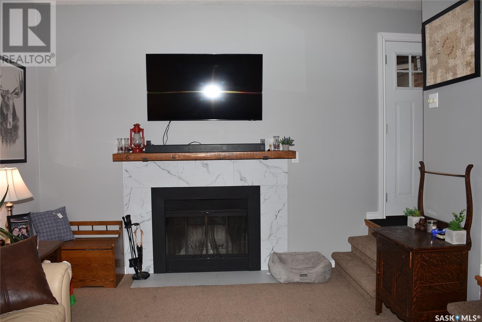 119 Dewdney Street, Indian Head, SK - Indoor Photo Showing Living Room With Fireplace