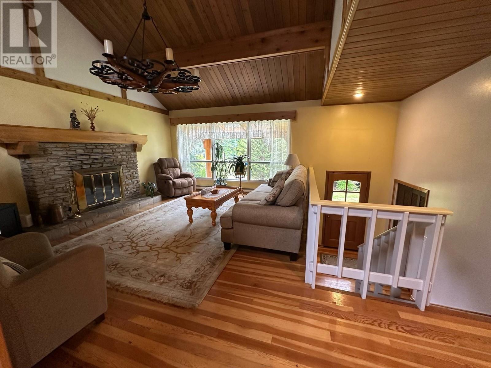 7047 Harrop-Procter Road, Harrop, BC - Indoor Photo Showing Other Room With Fireplace