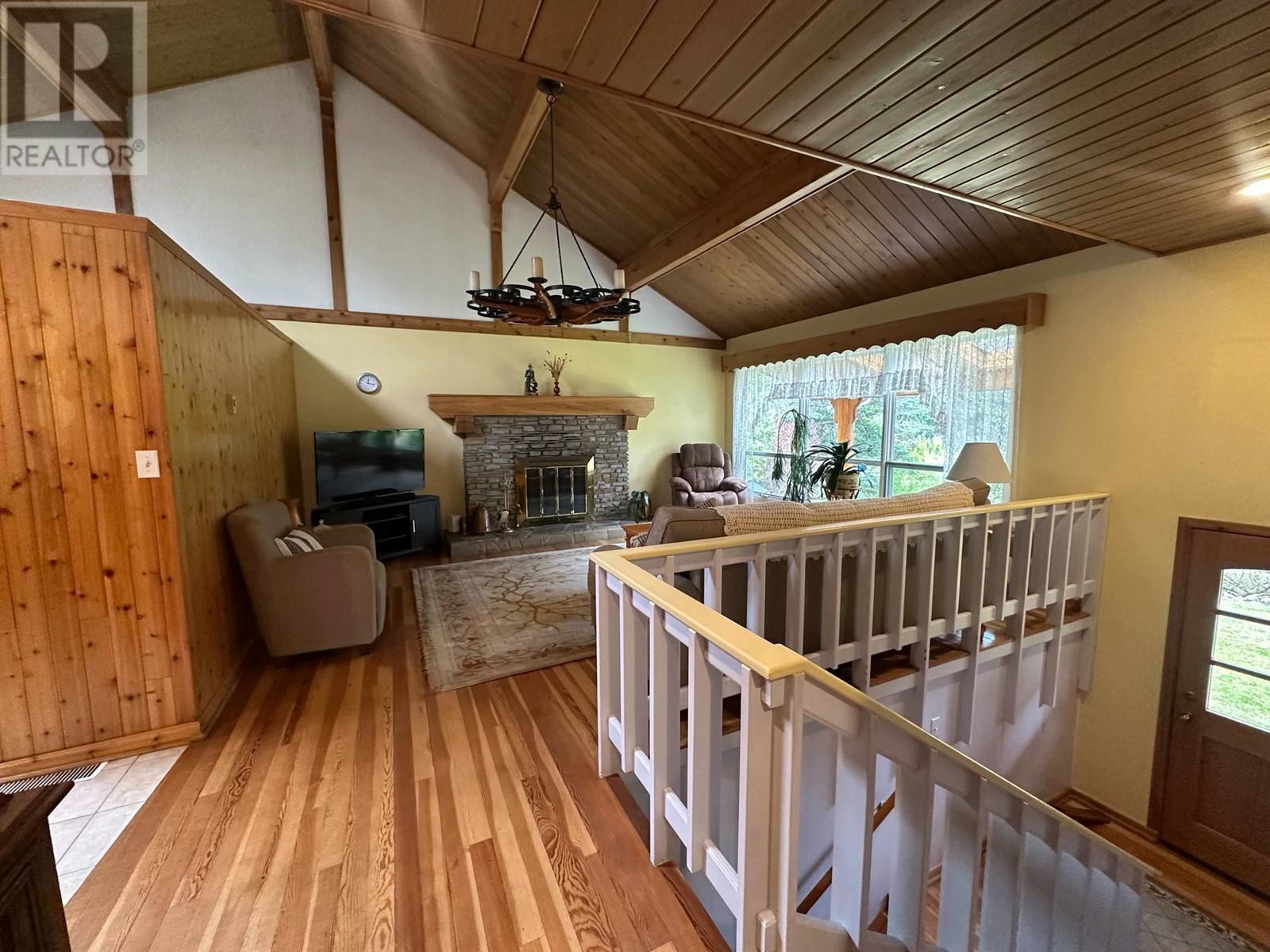 7047 Harrop-Procter Road, Harrop, BC - Indoor Photo Showing Other Room With Fireplace