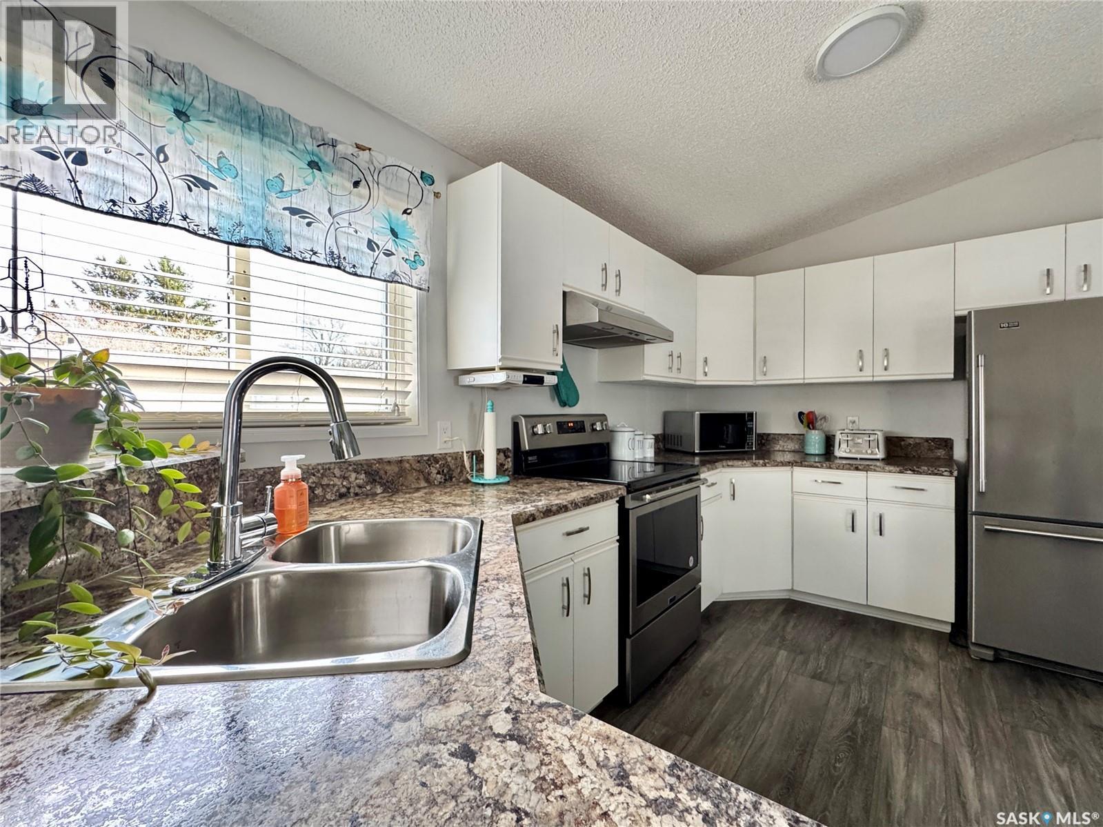 317 Riedel Avenue E, Langenburg, SK - Indoor Photo Showing Kitchen With Stainless Steel Kitchen With Double Sink