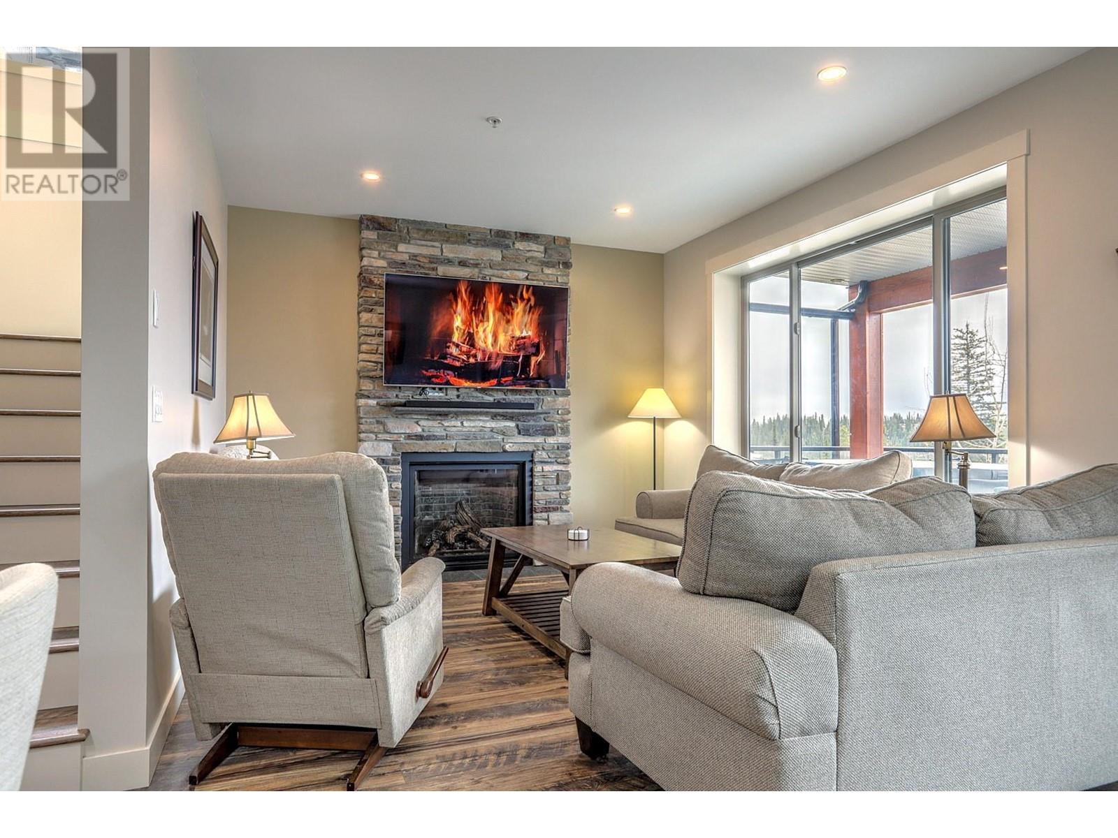 9834 Cathedral Drive, Silver Star, BC - Indoor Photo Showing Living Room With Fireplace