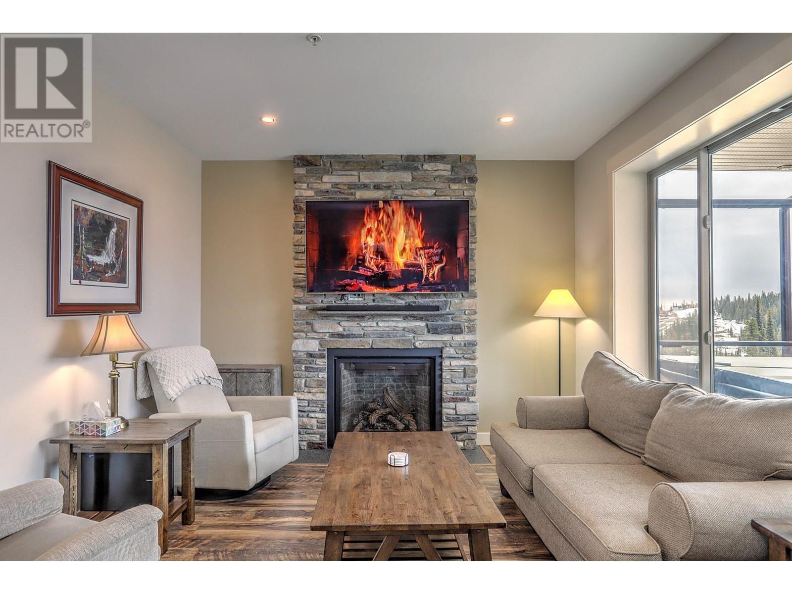 9834 Cathedral Drive, Silver Star, BC - Indoor Photo Showing Living Room With Fireplace