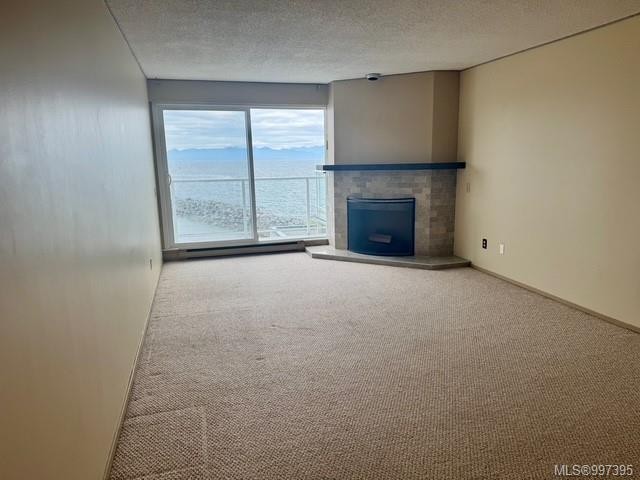 407-3555 Outrigger Rd, Nanoose Bay, BC - Indoor Photo Showing Other Room With Fireplace