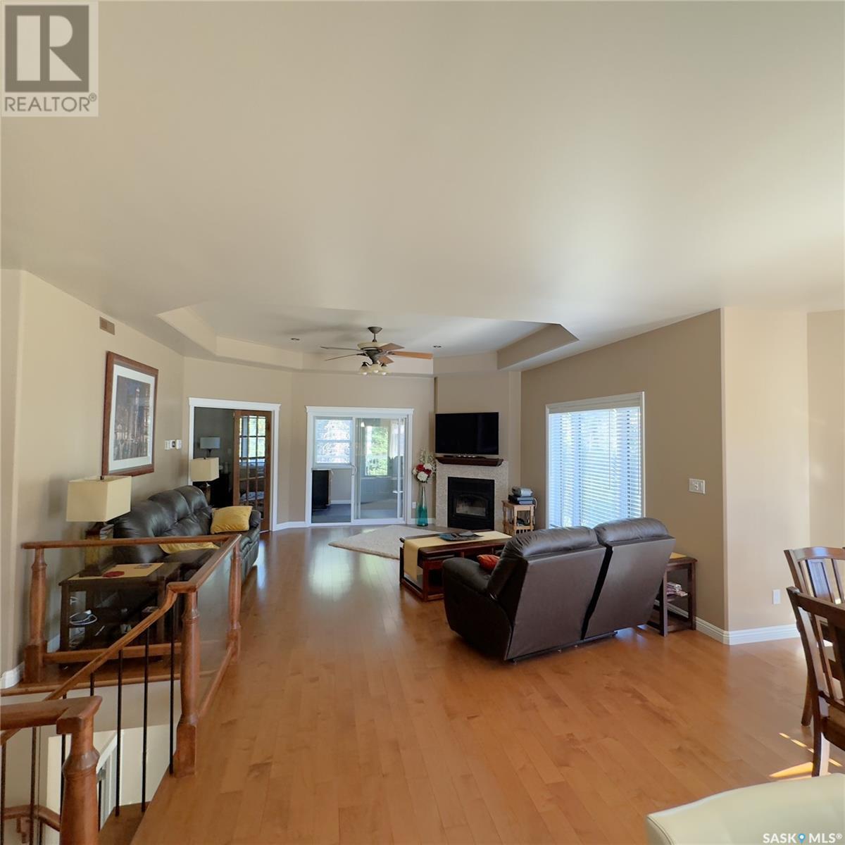 82 Estates Drive, Elk Ridge, SK - Indoor Photo Showing Living Room With Fireplace