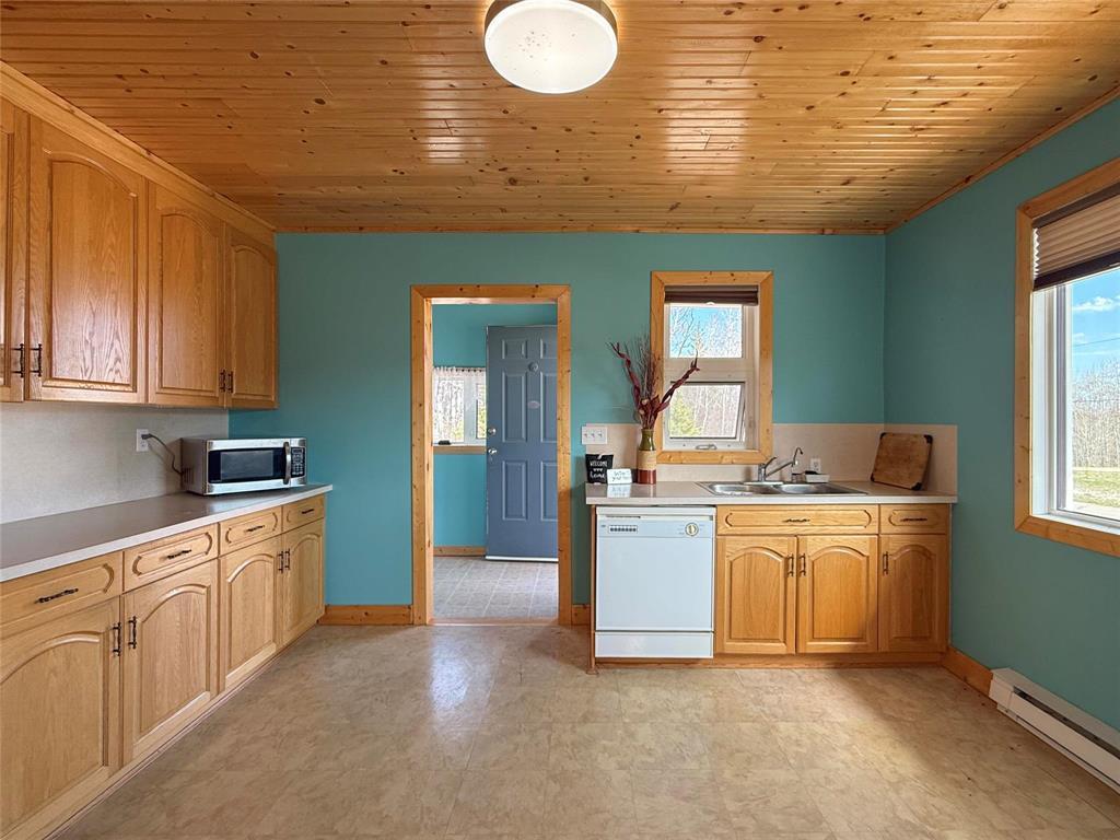107 Crestview Drive, Onanole, MB - Indoor Photo Showing Kitchen With Double Sink