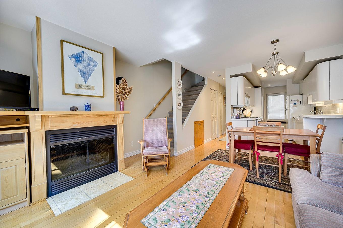 Living room - 102-273 Ch. Des Grappes, Piedmont, QC - Indoor Photo Showing Living Room With Fireplace