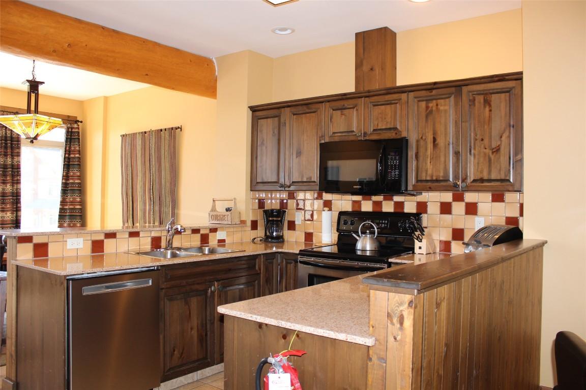 O3-C-1351 Gerry Sorensen Way, Kimberley, BC - Indoor Photo Showing Kitchen With Double Sink