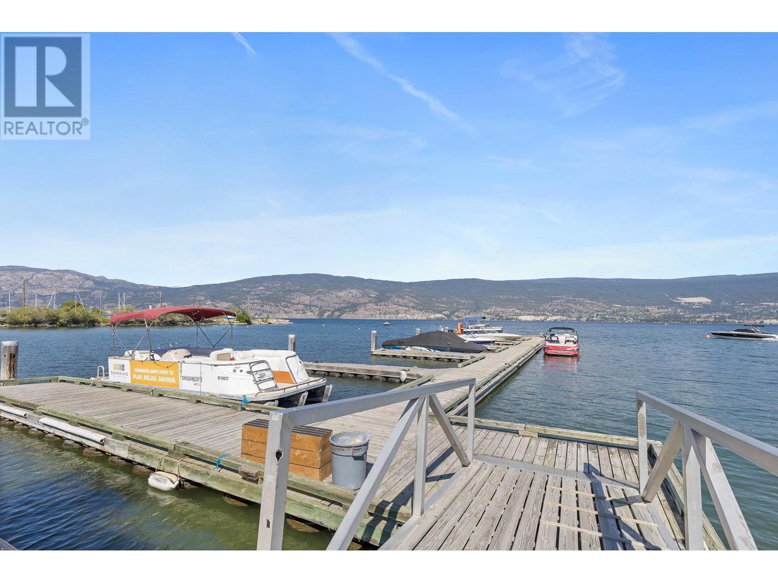 12811 Lakeshore Drive S Unit# 410/411, Summerland, BC - Outdoor With Body Of Water With Deck Patio Veranda With View
