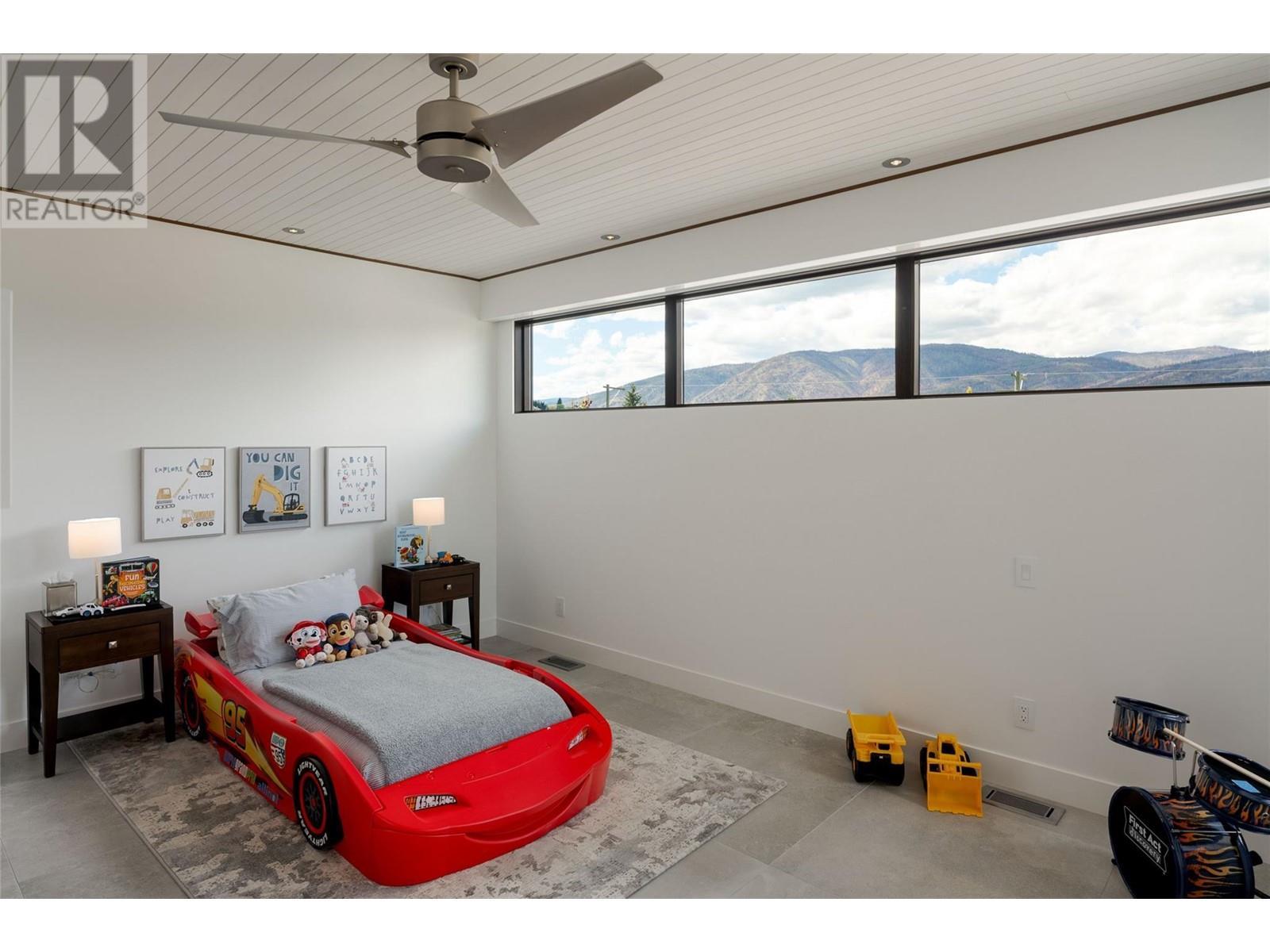 Fifth bedroom on upper level - 2463 Thacker Drive, West Kelowna, BC - Indoor Photo Showing Bedroom