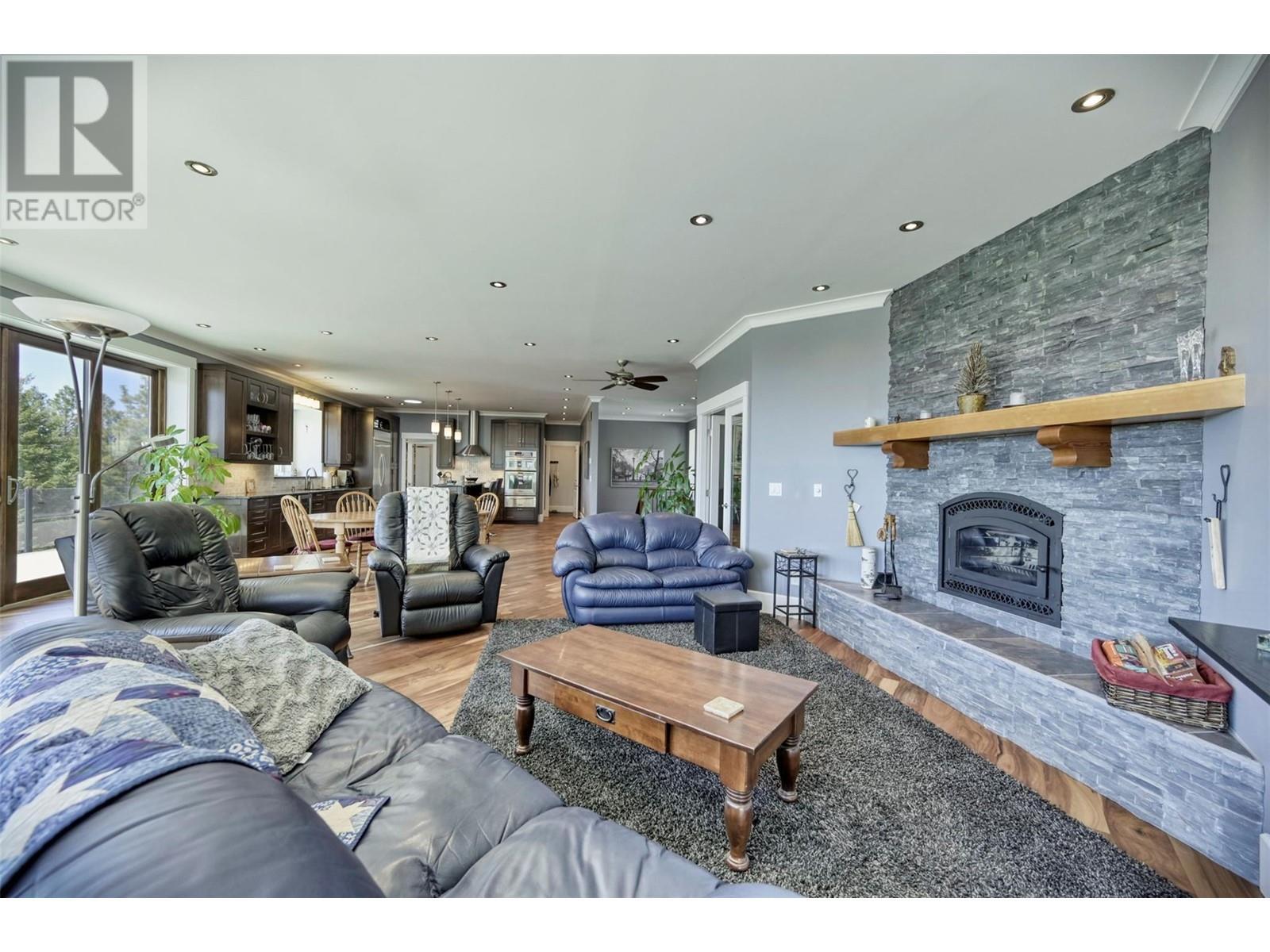 148 Sasquatch Trail, Osoyoos, BC - Indoor Photo Showing Living Room With Fireplace