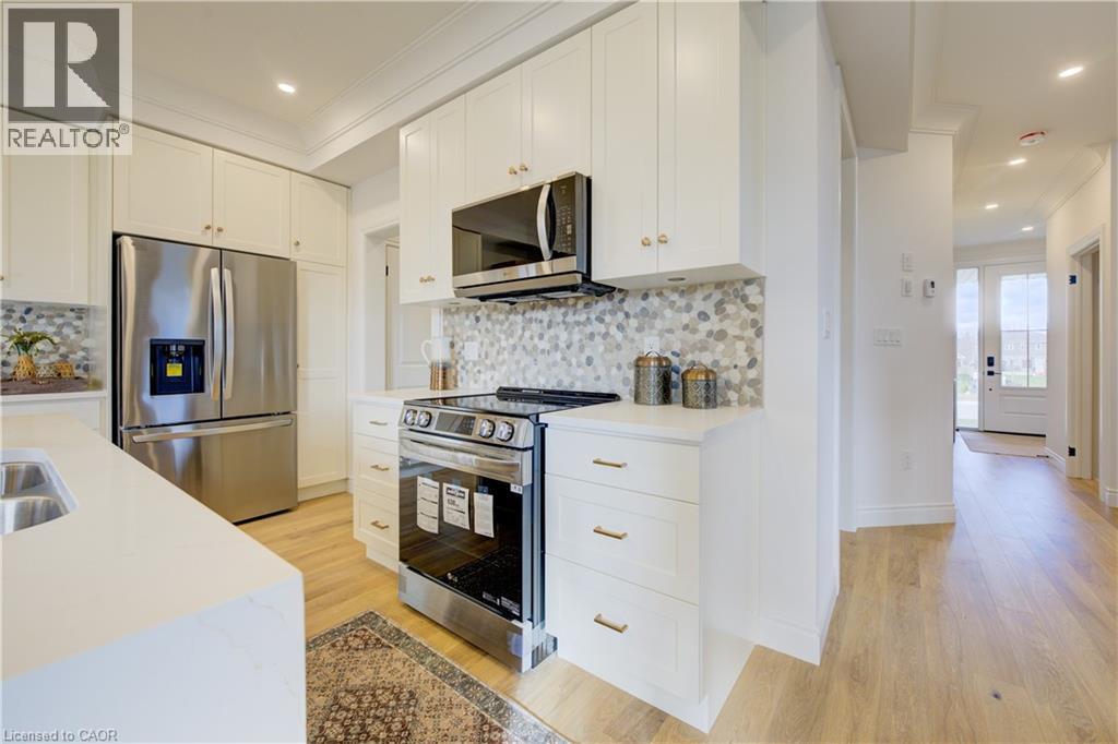 109 Thackeray Way, Harriston, ON - Indoor Photo Showing Kitchen With Double Sink With Upgraded Kitchen