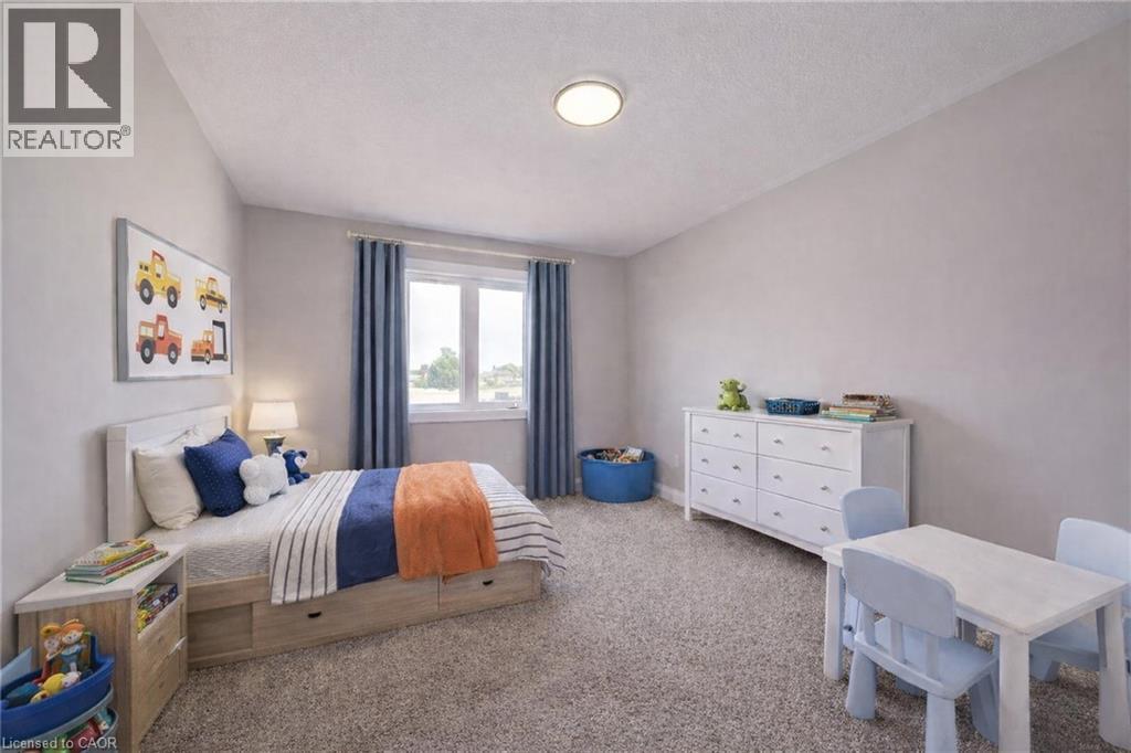 Virtaully staged - 102 Thackeray Way, Harriston, ON - Indoor Photo Showing Bedroom